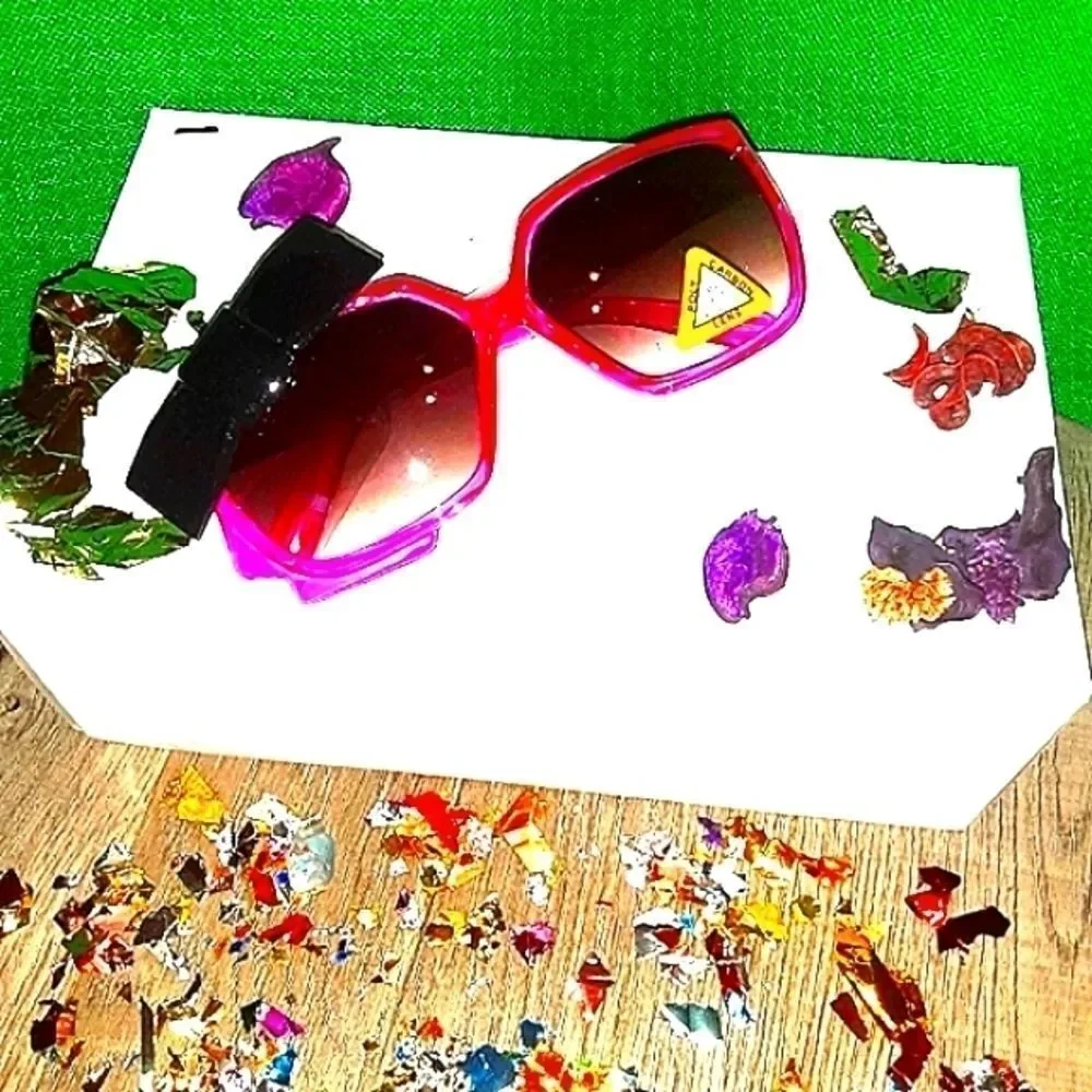 SUPER cute Girl's and women sunglasses with bow detail on the side.